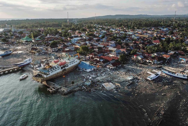 A ship is seen stranded on the shore after an earthquake and tsunami hit the area in Wani 