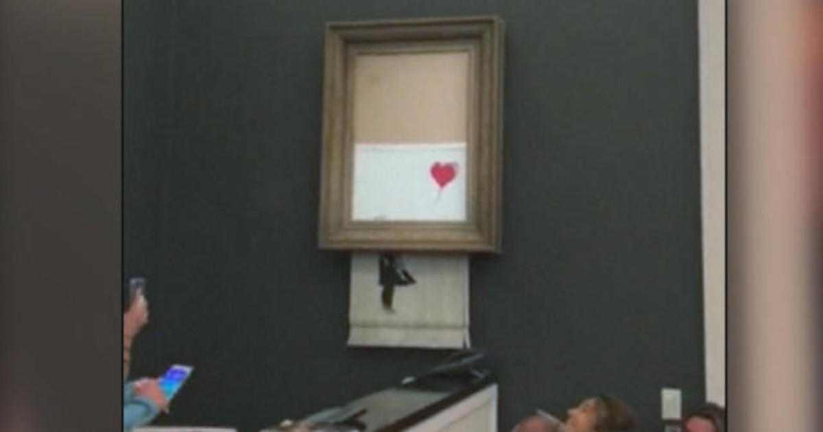 Banksy Painting Self-destructs After Selling For Over $1 Million - CBS News