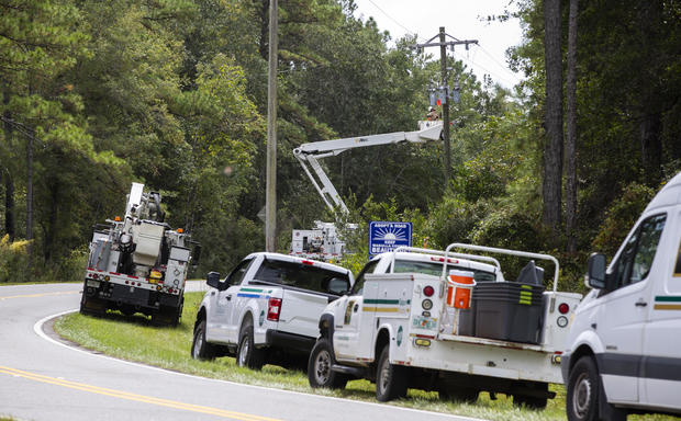 Talquin Electric linemen in Crawfordville, Florida, shut off the power to Shell Point Beach prior to the arrival of Hurricane Michael on Oct. 9, 2018. 