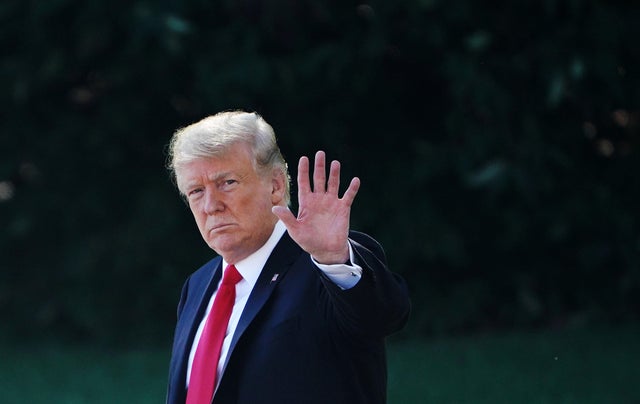 President Trump waves as he walks to Marine One on the South Lawn of the White House in Washington on Oct. 12, 2018.