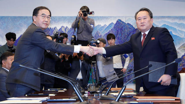 North Korea's Ri Son Gwon shakes hands with South Korean Unification Minister Cho after exchanging the joint statement during their meeting at the truce village of Panmunjom 