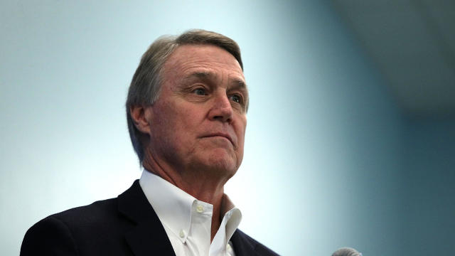 U.S. Sen. David Perdue, R-Georgia, listens during a news briefing at the 2018 House & Senate Republican Member Conference Feb. 1, 2018, at the Greenbrier resort in White Sulphur Springs, West Virginia. 