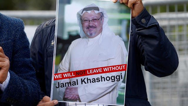 A demonstrator holds picture of Saudi journalist Jamal Khashoggi during a protest in front of Saudi Arabia's consulate in Istanbul 