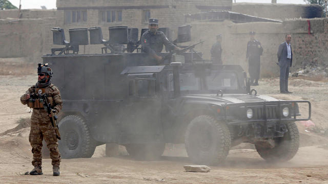 Afghan security forces arrive at the site of a suicide attack in Kabul 