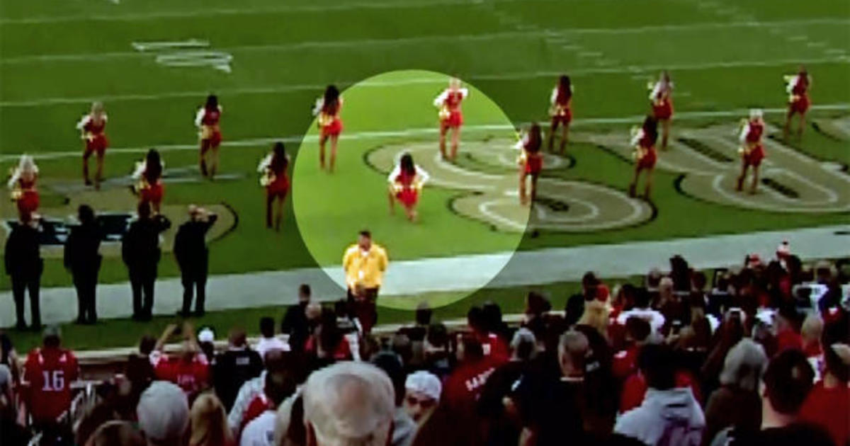 San Francisco 49ers cheerleader kneels during national anthem