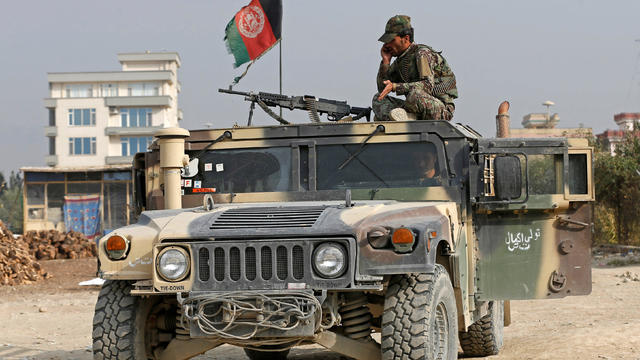 An Afghan National Army soldier keeps watch near the site of a suicide attack in Kabul 