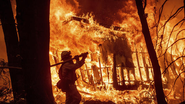 Firefighters work to control flames from a backfire during the Maria Fire in Santa Paula, California, on November 1, 2019. 