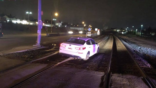 woman-driving-on-railroad-tracks-duquesne.jpg 