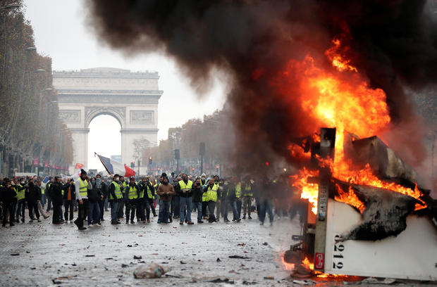 A truck burns during a "Yellow vest" protest against higher fuel prices during clashes on the Champs-Elysees in Paris 