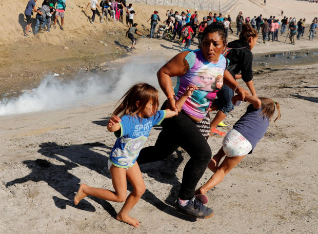 migrant caravan — tear gas at U.S.-Mexico border 
