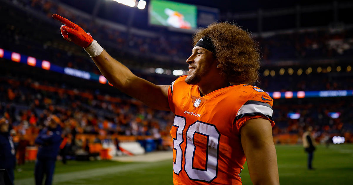 Denver, Colorado, USA. 1st Dec, 2019. Broncos RB PHILLIP LINDSAY starts to  take off his jersey to exchange with a Chargers player during the end of  the game at Empower Field At