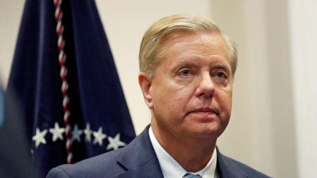 Sen. Lindsey Graham (R-SC) waits for U.S. President Donald Trump to enter the room to speak about the "First Step Act" in the Roosevelt Room at the White House in Washington, U.S. 