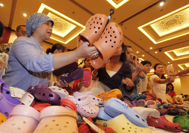 Indonesians choose Crocs footwear during sales at a shopping mall in Jakarta 