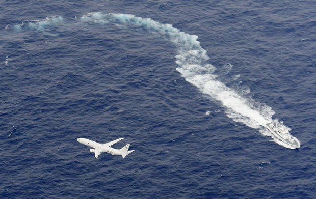 A Japan Coast Guard patrol vessel and U.S. Navy airplane conduct search and rescue operation at the area where two U.S. Marine Corps aircraft have been involved in a mishap in the skies, off the coast of Kochi prefecture 