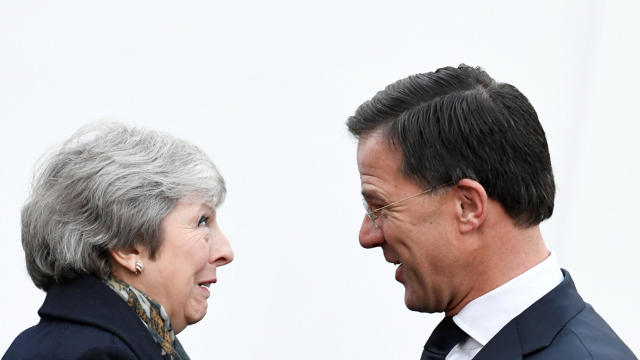 British PM May is welcomed by Dutch PM Rutte 