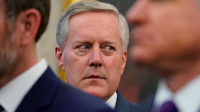 Rep. Mark Meadows watches President Trump talk to reporters after signing Iraq and Syria Genocide Relief and Accountability Act at White House in Washington 