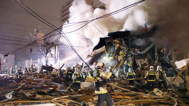 Firefighters operate at the site where a large explosion occurred at a restaurant in Sapporo, Hokkaido 