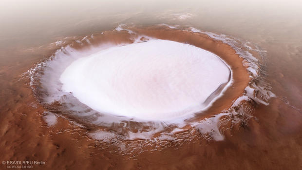 A mile-deep ice crater and marsquakes 