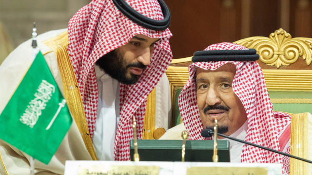 Saudi Arabia's Crown Prince Mohammed bin Salman talks with Saudi Arabia's King Salman bin Abdulaziz Al Saud during the Gulf Cooperation Council's (GCC) Summit in Riyadh 