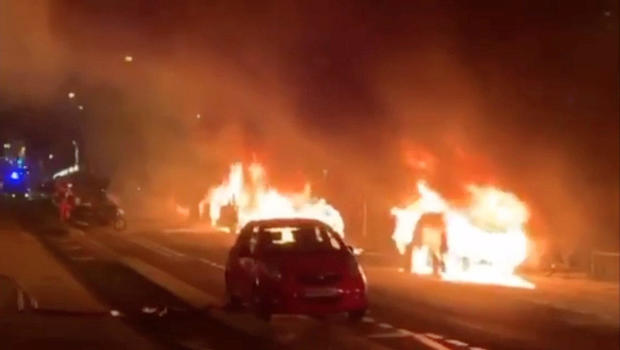 Cars are set on fire during a protest by the "yellow vests" movement in Paris 