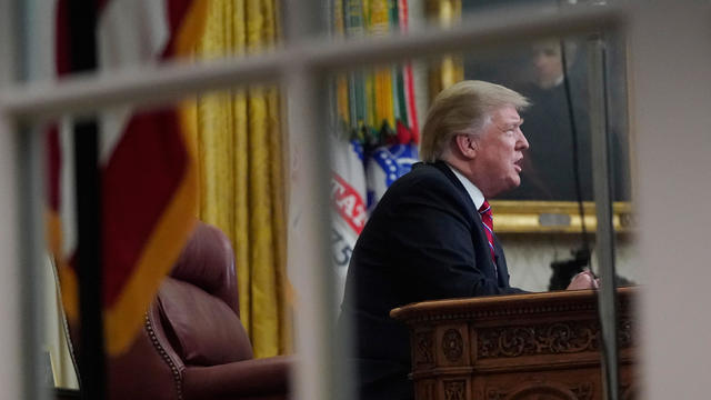 President Donald Trump delivers a televised address to the nation from his desk in the Oval Office at the White House in Washington 