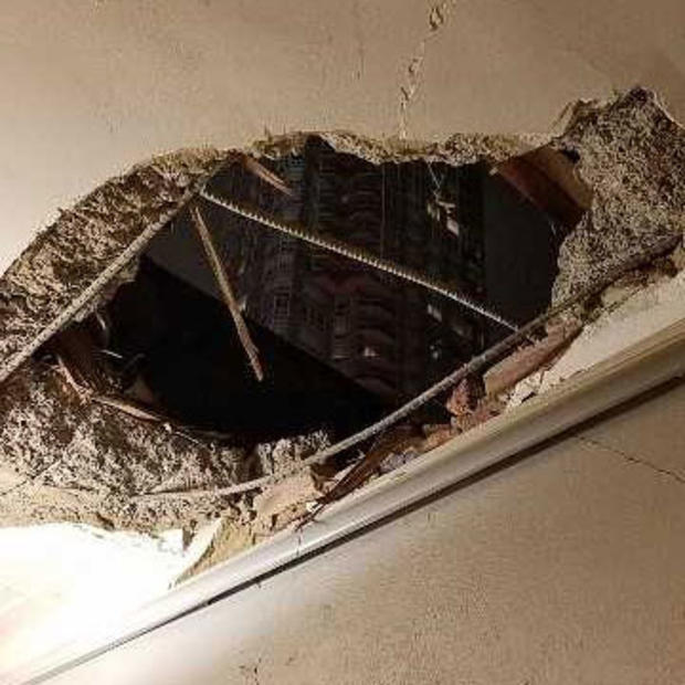 DOB Photo Of Hole Caused By Falling Debris 