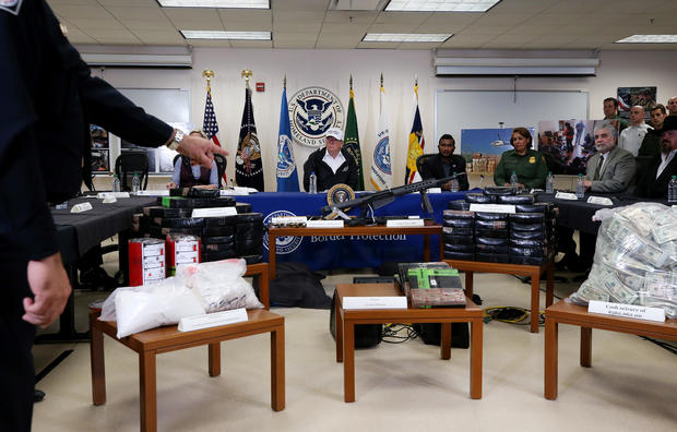 Officer indicates serized items as U.S. President Trump speaks during visit to U.S.-Mexico border in McAllen, Texas 