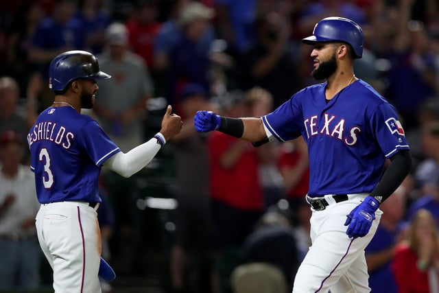 Nomar Mazara of the Texas Rangers celebrates with Delino DeShield 