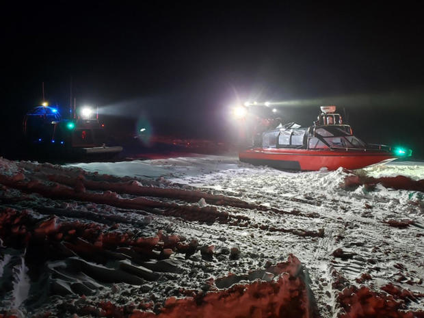 Crews from the Coast Guard and Wisconsin Department of Natural Resources respond to seven people stranded on iced-over water near Sturgeon Bay, Wisconsin, Jan. 29, 2019. 