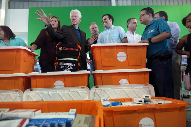 Former U.S. President Clinton and Puerto Rico Governor Rosello visit a school turned shelter for people who have lost their homes during Hurricane Maria in September, in Canovanas 