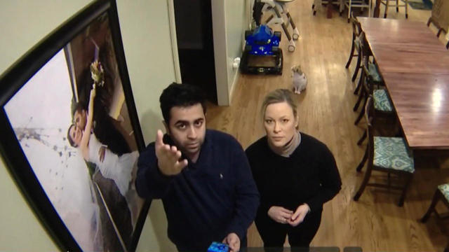 Arjun Sud and WBBM-TV's Dana Kozlov look up at Sud's Nest camera in his home in Lake Barrington, Illinois, in a story broadcast on Jan. 30, 2019. 