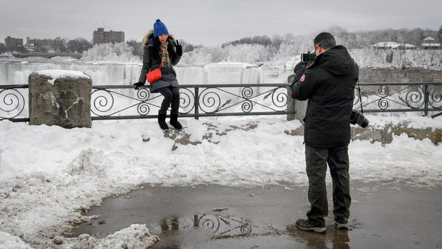 Boiling water freezes as it is thrown during subzero temperatures carried by the polar vortex in Chicago 