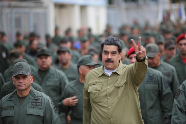 Venezuela's President Nicolas Maduro gestures during a meeting with soldiers at a military base in Caracas 