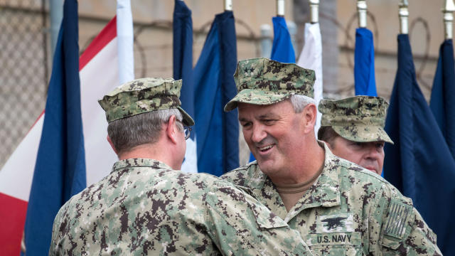 Rear Adm. Collin Green, center right, shakes the hand of Rear Adm. Tim Szymanski after relieving him as commander of Naval Special Warfare Command during a change of command ceremony at Naval Amphibious Base Coronado in California  Sept. 7, 2018. 