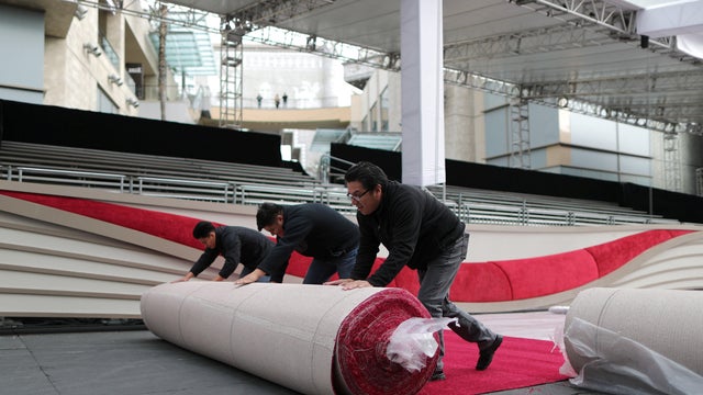 Workers roll out the Oscars red carpet as preparations continue for the 91st Academy Awards in Hollywood, Los Angeles 