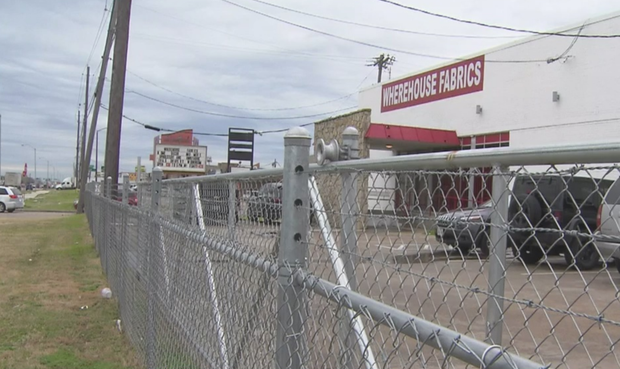 fence outside Wherehouse Fabrics 