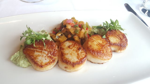 seared-jumbo-sea-scallops-with-grilled-pineapple-salsa-and-whipped-avocado-photo-credit-landrys-inc.jpg 