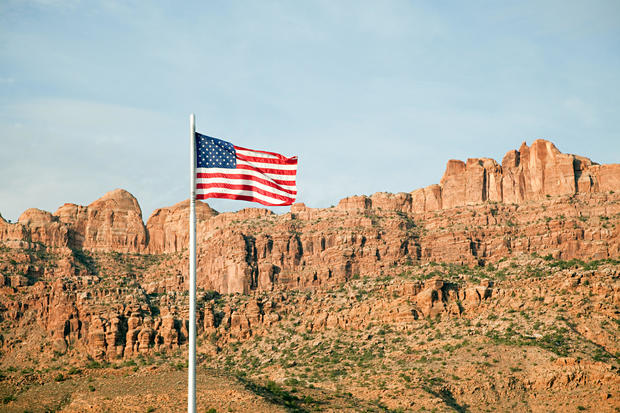 American flag and Gold Bar Rim, Moab, Utah, USA 