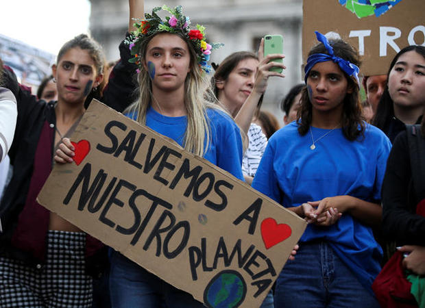 A student holds a placard during a protest to demand global action on climate change as part of the "Fridays for Future" movement in Buenos Aires 