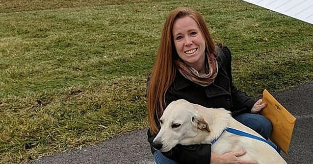 Dog rescued from high kill shelter hugs new owner - CBS News