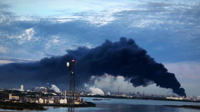 Handout photo of smoke rising from a fire burning at the Intercontinental Terminals Company in Deer Park, east of Houston 