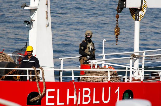 A Maltese special forces soldier is seen on the merchant ship Elhiblu 1 after it arrived in Senglea 