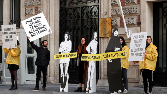 Demonstrators from Amnesty International protest outside the Saudi Arabian Embassy on International Women's day in Paris 