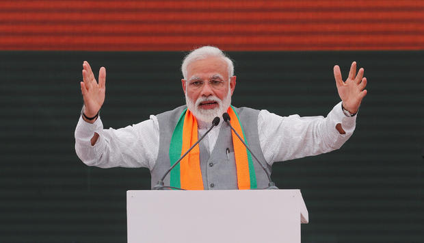 FILE PHOTO: Indian Prime Minister Narendra Modi gestures as he speaks after releasing BJP's election manifesto for the April/May general election, in New Delhi 