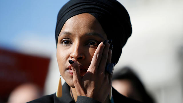 Rep. Omar wipes tears from her eye as she speaks about Trump administration policies towards Muslim immigrants at a news conference outside the U.S. Capitol in Washington 