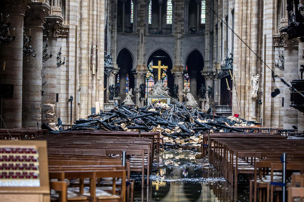 A view of the debris inside Notre-Dame de Paris in the aftermath of a fire that devastated the cathedral, during the visit of French Interior Minister Christophe Castaner in Paris 
