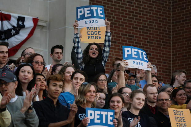 Attendees cheer as 2020 Democratic presidential candidate Pete Buttigieg speaks at a campaign event in Des Moines, Iowa 