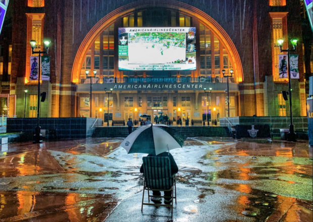 Dave Friant watches Stars game in the rain 
