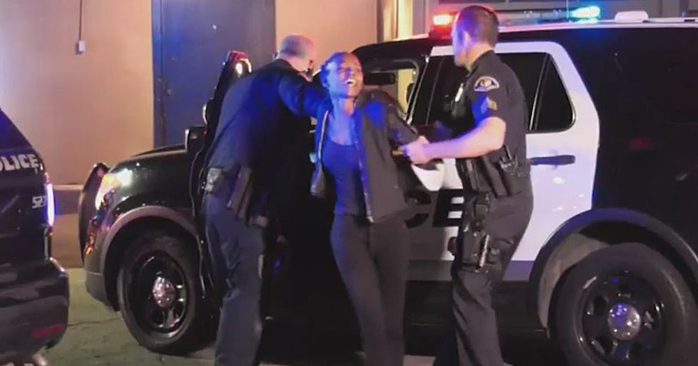 Police Woman Tries To Run Away With Child In Her Arms After Car Chase