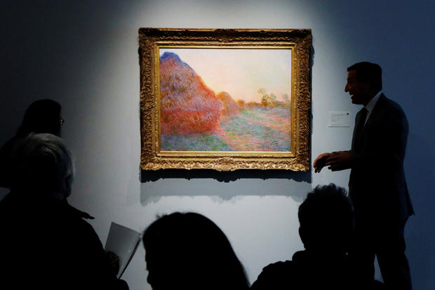 Monet painting part of "Les Meules" is displayed at Sotheby's during a press preview of their upcoming impressionist and modern art sale in New York 